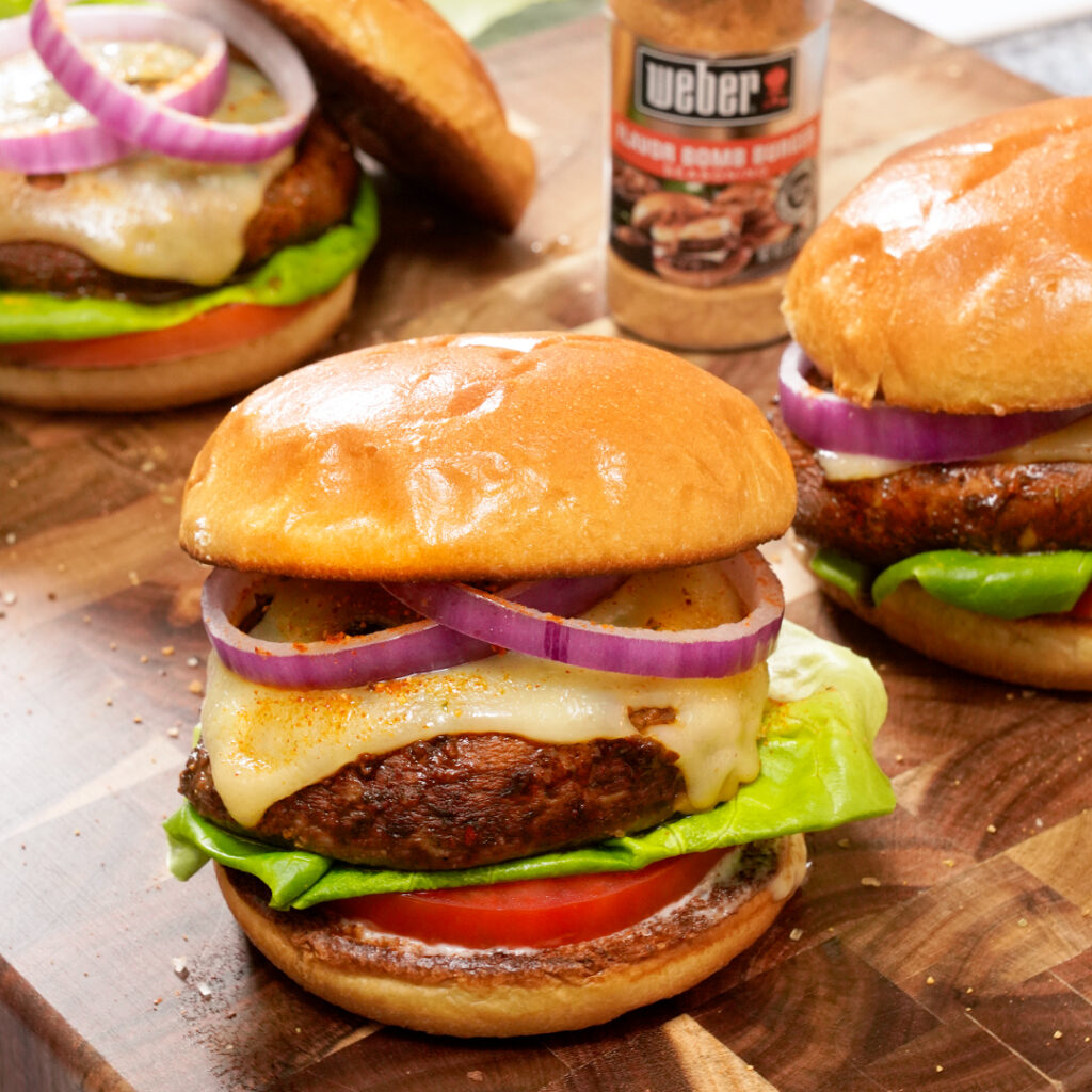Swiss Mushroom Burger Recipe Image showing finished burger and Weber seasoning product.